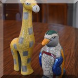 D41. Crackle glazed penguin and giraffe figurines. 